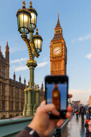 Taking and posting photo of Big ben in winter morning, Londonの写真素材