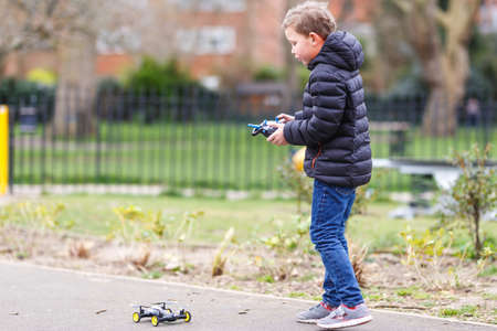 School boy with quadrocopter inthe park, Londonの写真素材