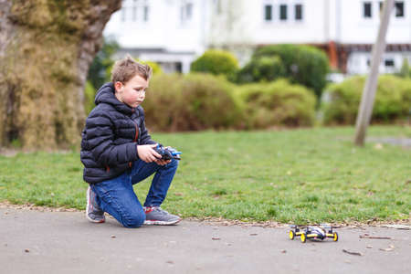 School boy with quadrocopter inthe park, Londonの写真素材