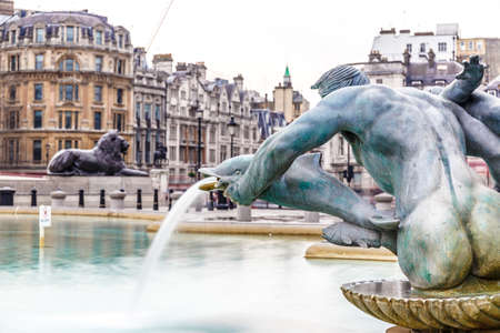 Fountain in spring at Trafalgar square, Londonの写真素材