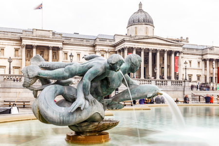 Fountain in spring at Trafalgar square, Londonの写真素材
