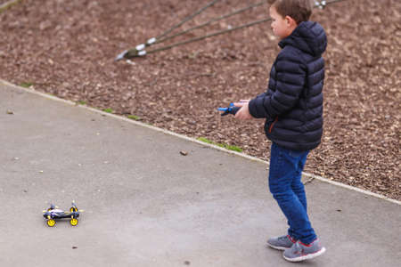 School boy with quadrocopter inthe park, Londonの写真素材