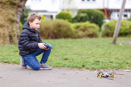 School boy with quadrocopter inthe park, Londonの写真素材