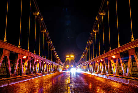 A view of Menai Suspension Bridge, a bridge connecting the island of Anglesey and the mainland of Wales, UKの写真素材