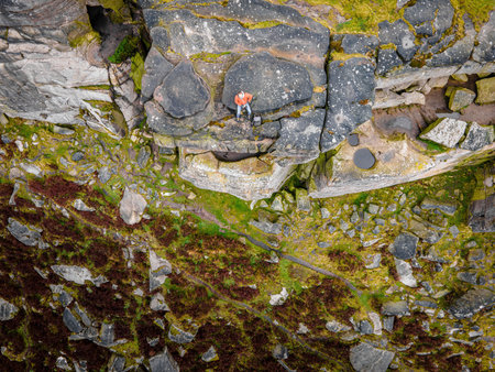 A photographer shooting in Peak District, an upland area in England at the southern end of the Pennines, UKの写真素材