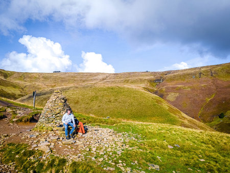 A photographer shooting in Peak District, an upland area in England at the southern end of the Pennines, UKの写真素材