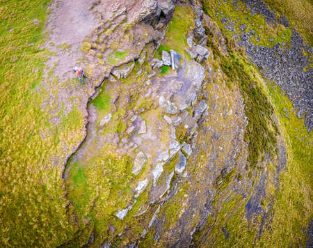 A photographer shooting in Peak District, an upland area in England at the southern end of the Pennines, UKの写真素材