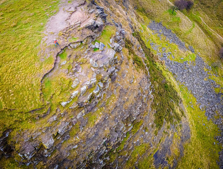 A photographer shooting in Peak District, an upland area in England at the southern end of the Pennines, UKの写真素材