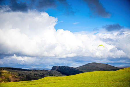 Paragliding in Peak district, an upland area in England at the southern end of the Pennines, UKの写真素材
