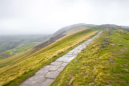 View of Mom tor in Peak district, an upland area in England at the southern end of the Pennines, UKの写真素材