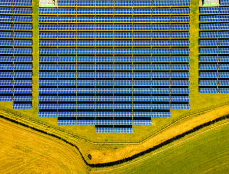 Aerial view of solar batteries field in english countryside, UKの写真素材