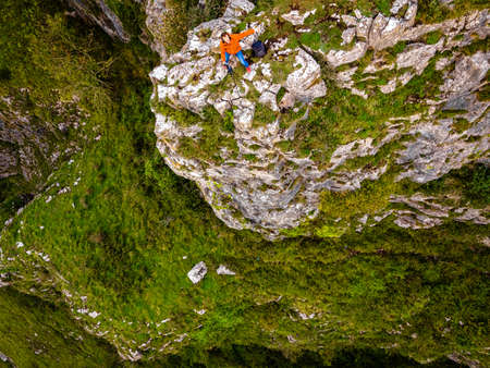 Photographer taking shots of limestone Cheddar Gorge in the Mendip Hills, near the village of Cheddar, Somerset, Englandの写真素材