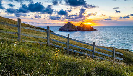 Gull rocks at sunset in Hollywell Bay in Cornwall, UKの写真素材