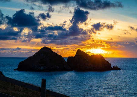 Gull rocks at sunset in Hollywell Bay in Cornwall, UKの写真素材
