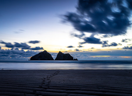 Gull rocks at sunset in Hollywell Bay in Cornwall, UKの写真素材