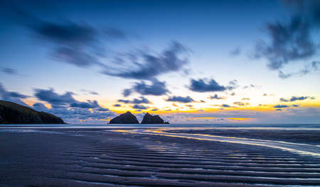Gull rocks at sunset in Hollywell Bay in Cornwall, UKの写真素材