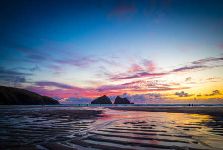 Gull rocks at sunset in Hollywell Bay in Cornwall, UKの写真素材