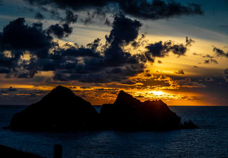 Gull rocks at sunset in Hollywell Bay in Cornwall, UKの写真素材