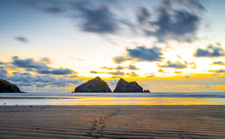 Gull rocks at sunset in Hollywell Bay in Cornwall, UKの写真素材