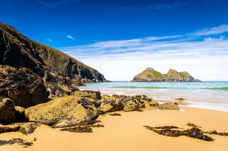 Gull rocks on sunny day in Hollywell Bay in Cornwall, UKの写真素材