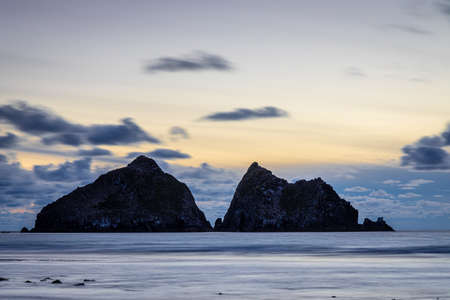 Gull rocks at sunset in Hollywell Bay in Cornwall, UKの写真素材