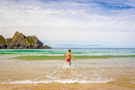 Gull rocks on sunny day in Hollywell Bay in Cornwall, UKの写真素材