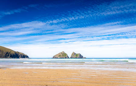 Gull rocks on sunny day in Hollywell Bay in Cornwall, UKの写真素材