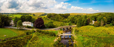 A view of Postbridge Clapper Bridge in Dartmoor National Park is a vast moorland in the county of Devon, in southwest England, UKの写真素材