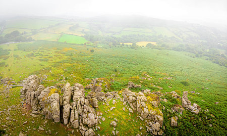 A view of Hound Tor in Dartmoor National Park is a vast moorland in the county of Devon, in...