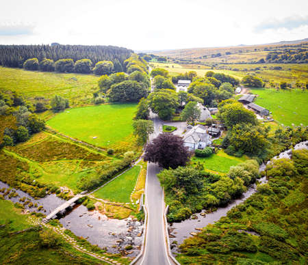 A view of Postbridge Clapper Bridge in Dartmoor National Park is a vast moorland in the county of Devon, in southwest England, UKの写真素材