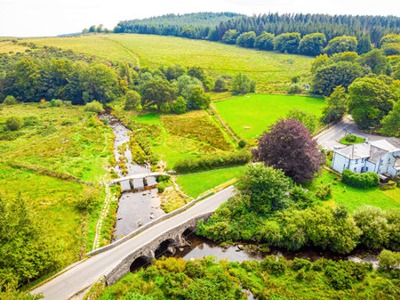 A view of Postbridge Clapper Bridge in Dartmoor National Park is a vast moorland in the county of...