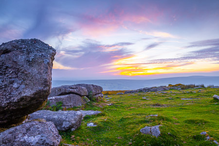 Sunset view of Dartmoor National Park, a vast moorland in the county of Devon, in southwest England,...