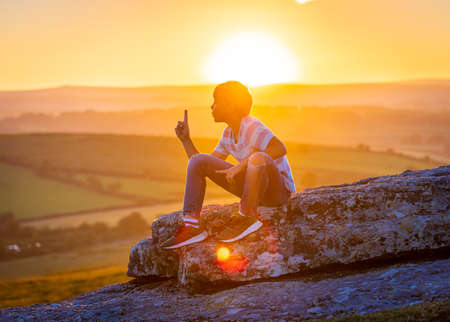 Kid in Dartmoor national park in the evening, UKの写真素材