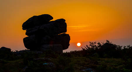 Sunset view of Dartmoor National Park, a vast moorland in the county of Devon, in southwest England, UKの写真素材