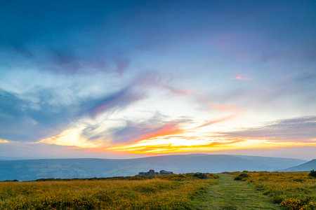 Sunset view of Dartmoor National Park, a vast moorland in the county of Devon, in southwest England,...