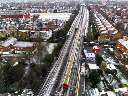 Aerial view of snowy London suburb in winter, UKの写真素材