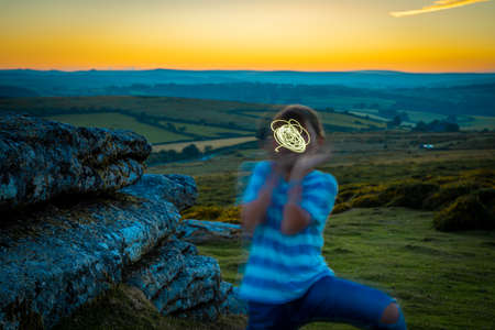 Kid in Dartmoor national park in the evening, UKの写真素材