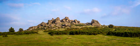 Sunset view of Dartmoor National Park, a vast moorland in the county of Devon, in southwest England, UKの写真素材