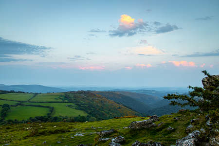Sunset view of Dartmoor National Park, a vast moorland in the county of Devon, in southwest England, UKの写真素材