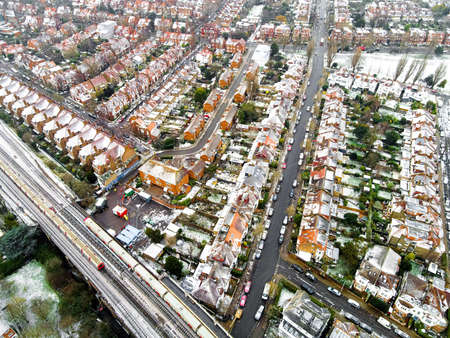 Aerial view of snowy London suburb in winter, UKの写真素材