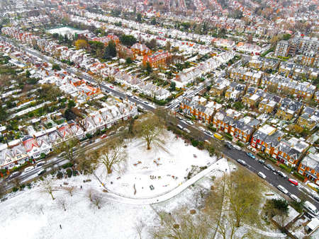 Aerial view of snowy London suburb in winter, UKの写真素材