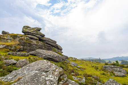 Sunset view of Dartmoor National Park, a vast moorland in the county of Devon, in southwest England, UKの写真素材