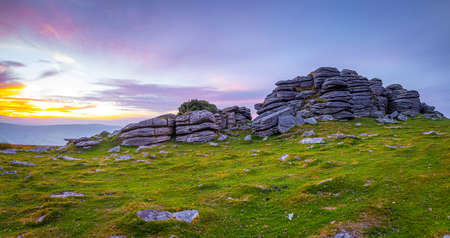 Sunset view of Dartmoor National Park, a vast moorland in the county of Devon, in southwest England, UKの写真素材