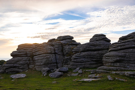 Sunset view of Dartmoor National Park, a vast moorland in the county of Devon, in southwest England,...
