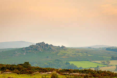Sunset view of Dartmoor National Park, a vast moorland in the county of Devon, in southwest England, UKの写真素材