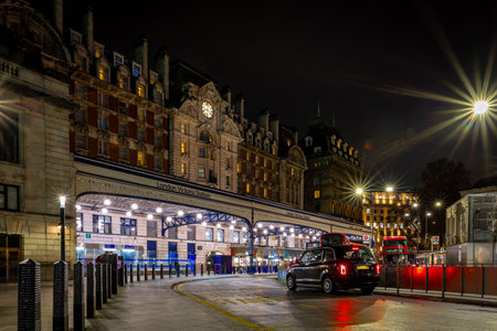 Entrance to Victoria train station in London in the night, UKの写真素材