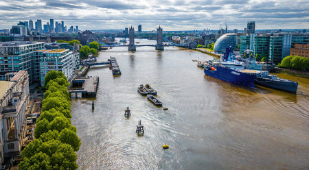View of research and military vessels docked on the Thames beside Tower Bridge and contemporary...