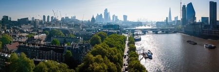 Wide aerial view of central London skyline and the River Thames on a sunny day