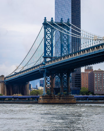 Iconic view of the Manhattan Bridge seen from DUMBO, Brooklyn, New York City, framed by brick buildings. Popular travel, tourism, architecture, and urban lifestyle photography subjectの写真素材