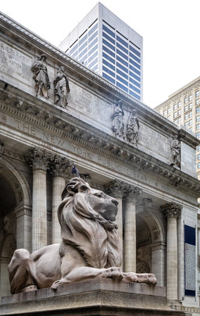 Famous lion statue at entrance of New York Public Library on Fifth Avenue, Manhattan. Iconic...